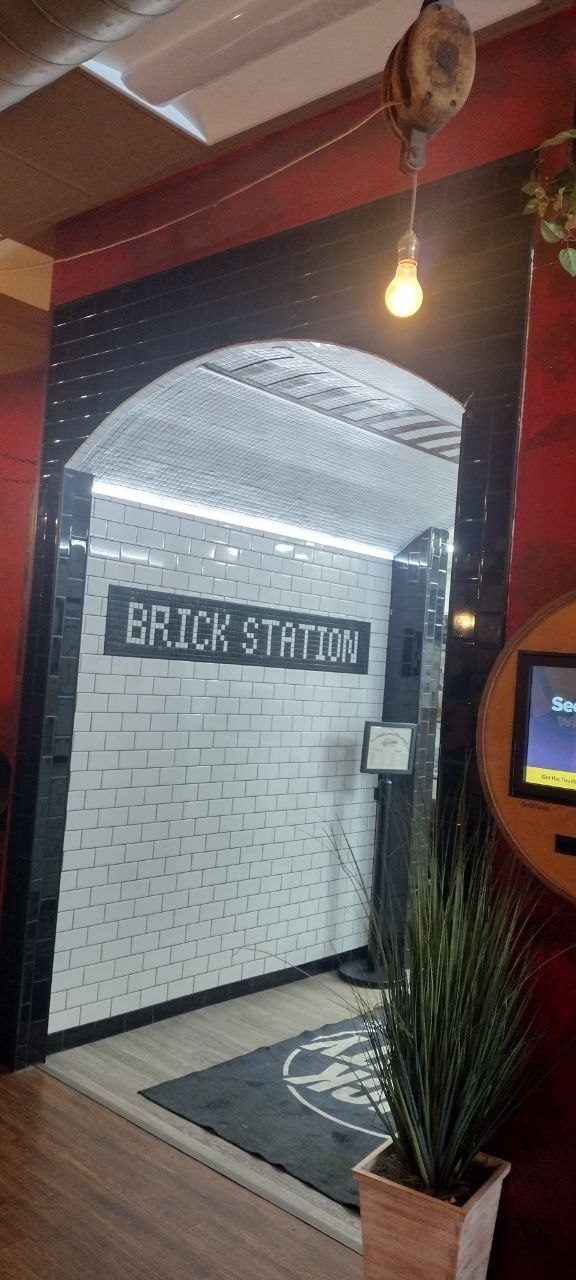The Brick Station subway-tile arch in the cafe