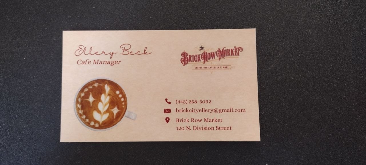 Cafe Manager Ellery Beck's Brick Row Market business card · Victorian wordmark in deep red, latte-art illustration, phone (443) 358-5092, email brickcityellery@gmail.com